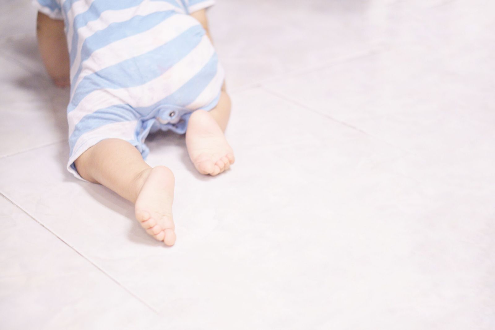 Baby crawling on a rug