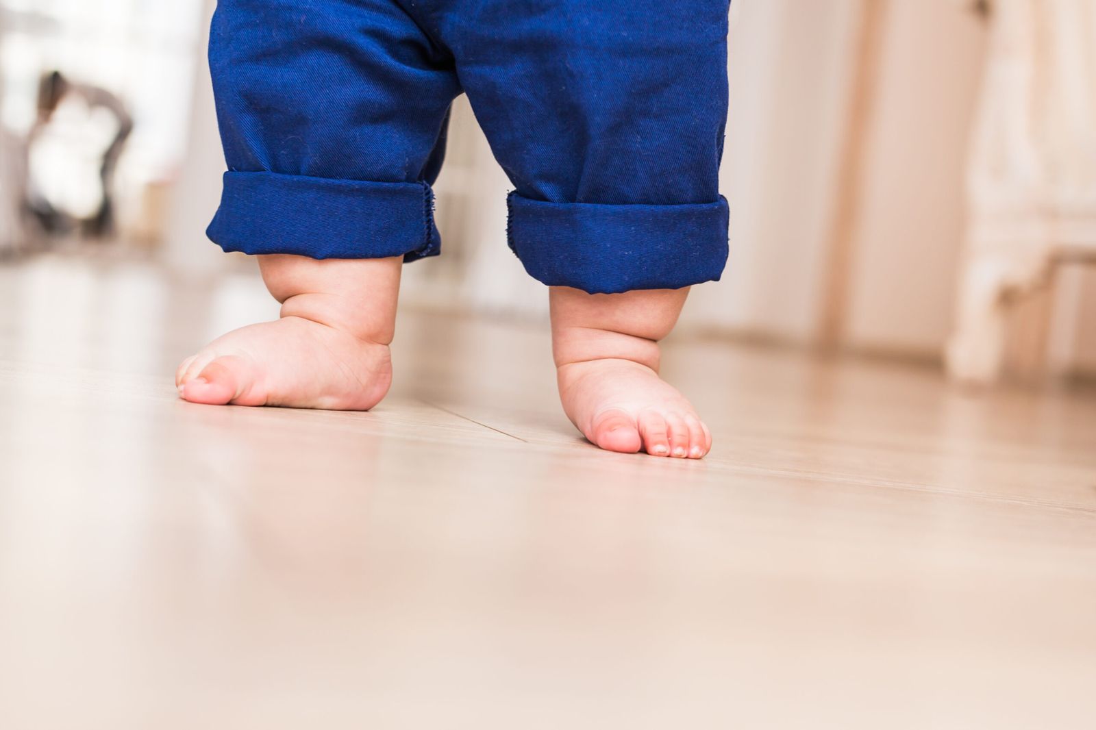 A baby's feet taking their first steps